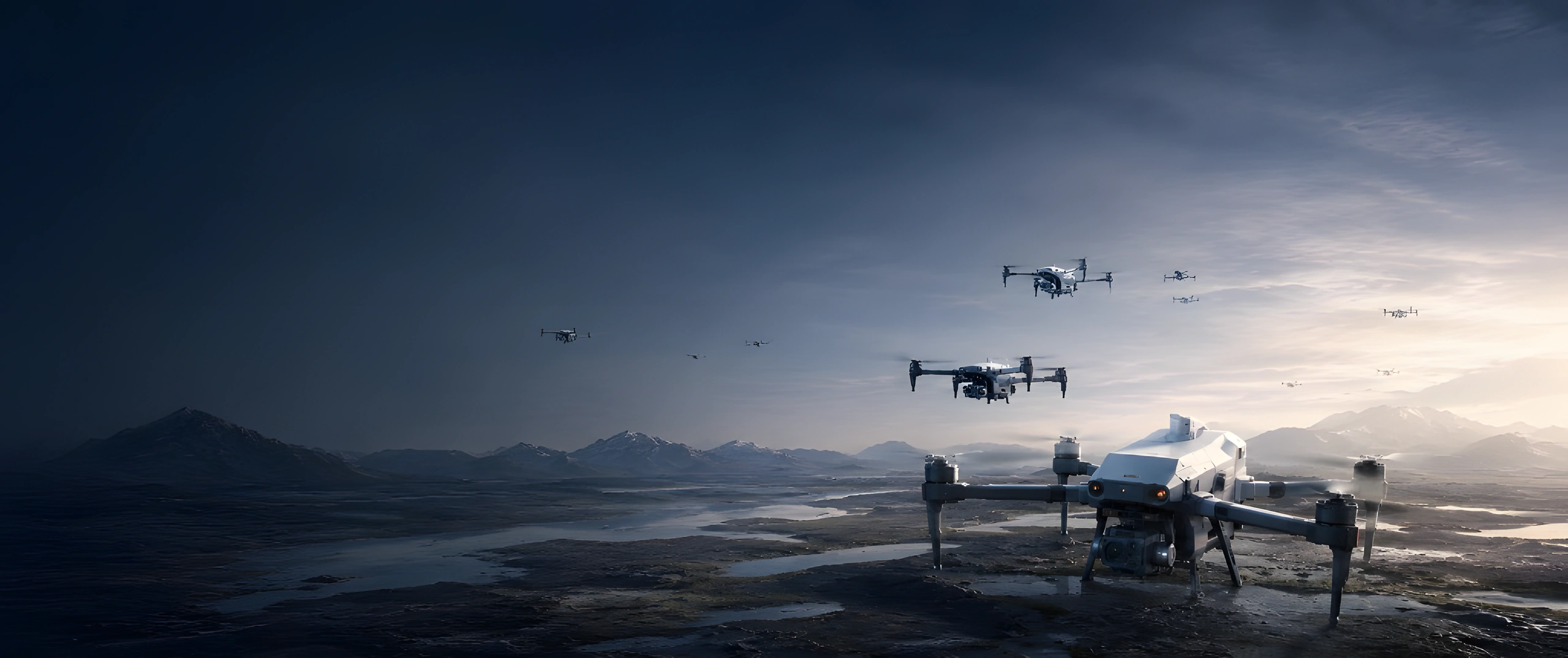Mithron drone fleet operating across a rugged mountain valley at golden hour