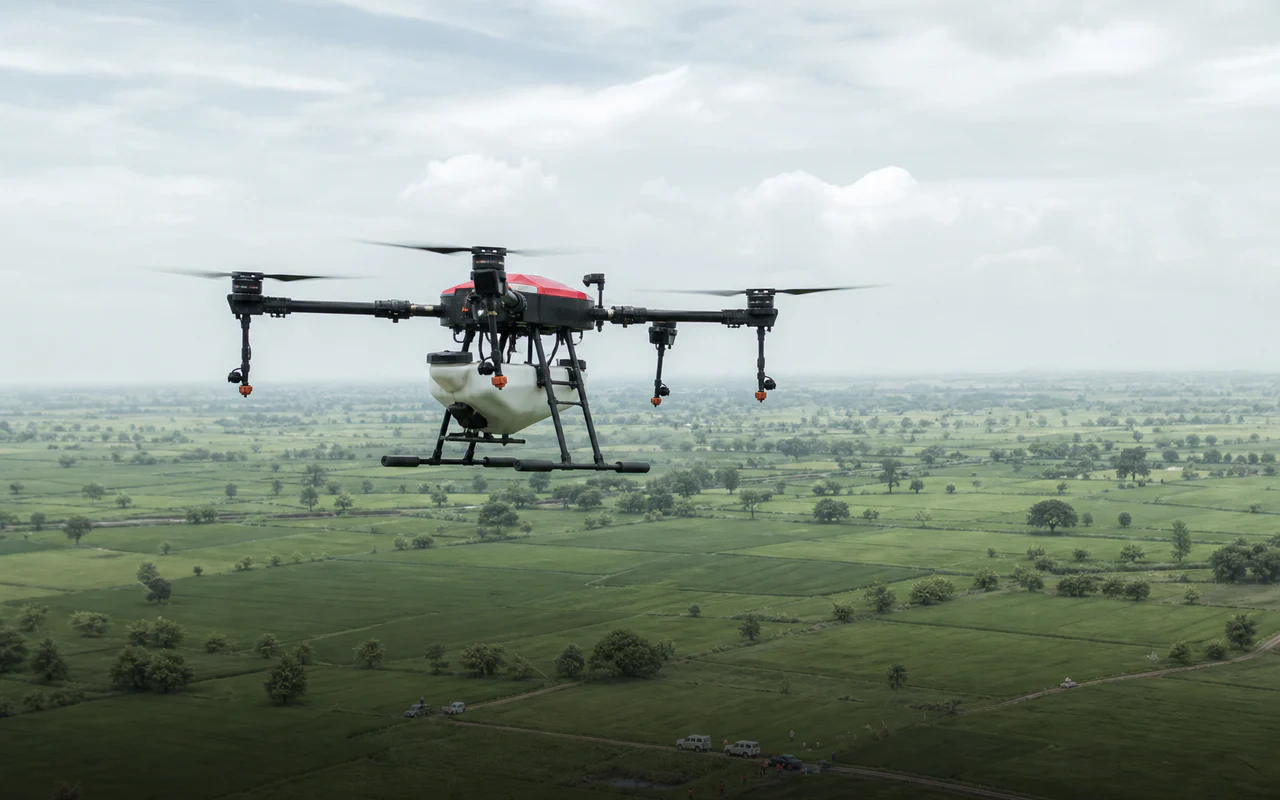 Agricultural drone flying above a nationwide Indian farmland service network